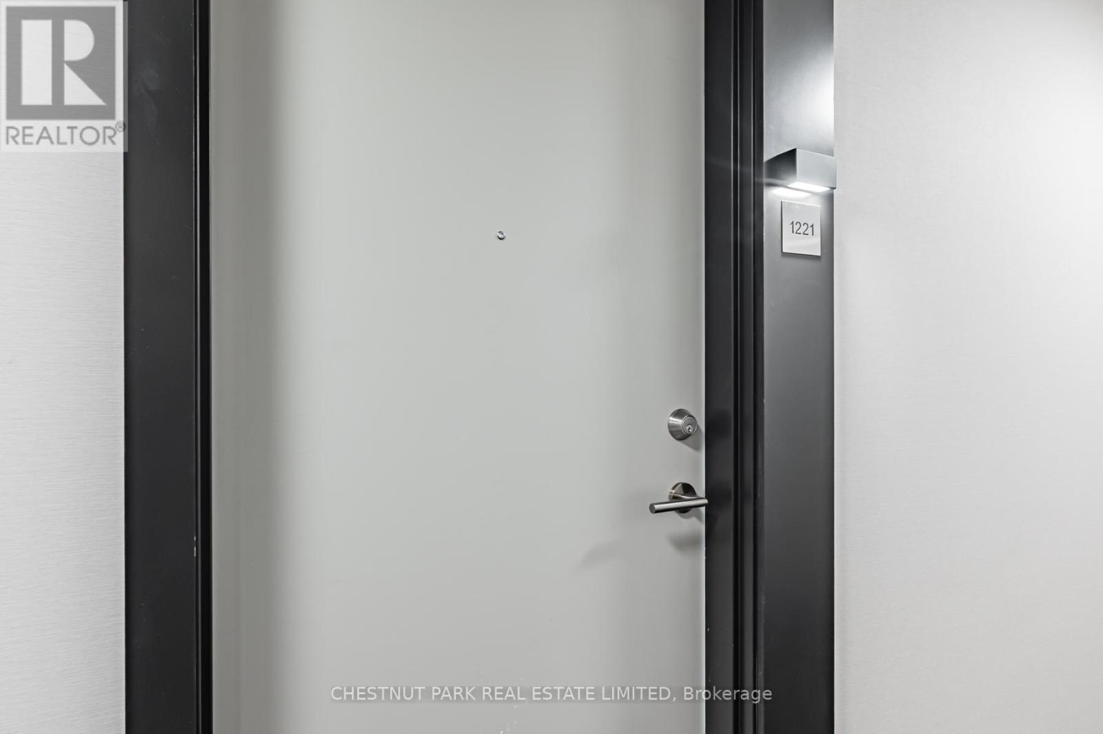 A door with a handle and a lock is closed.