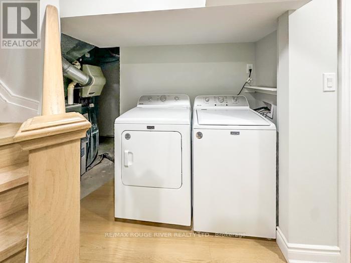 A white washer and dryer in a laundry room.