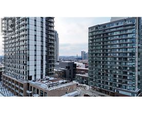 A cityscape with buildings and a clear sky.