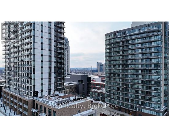 A cityscape with buildings and a clear sky.