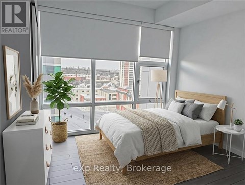 A bedroom with a large bed and a view of the city.