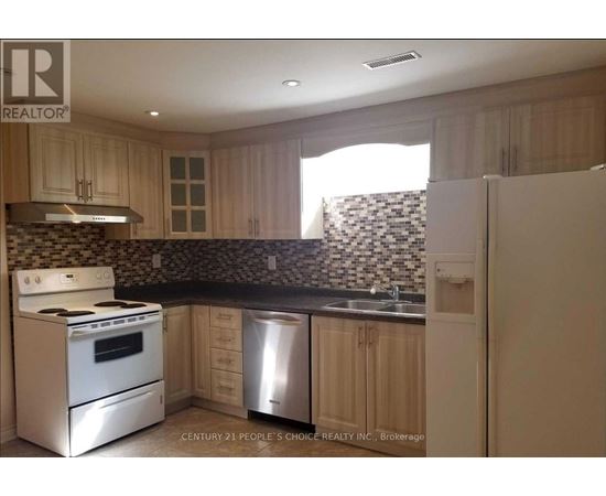 A kitchen with a stove top oven and a dishwasher.