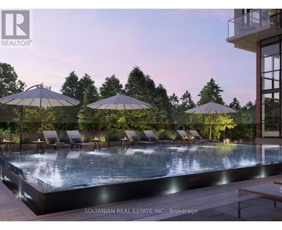 A pool area with lounge chairs and umbrellas is shown.