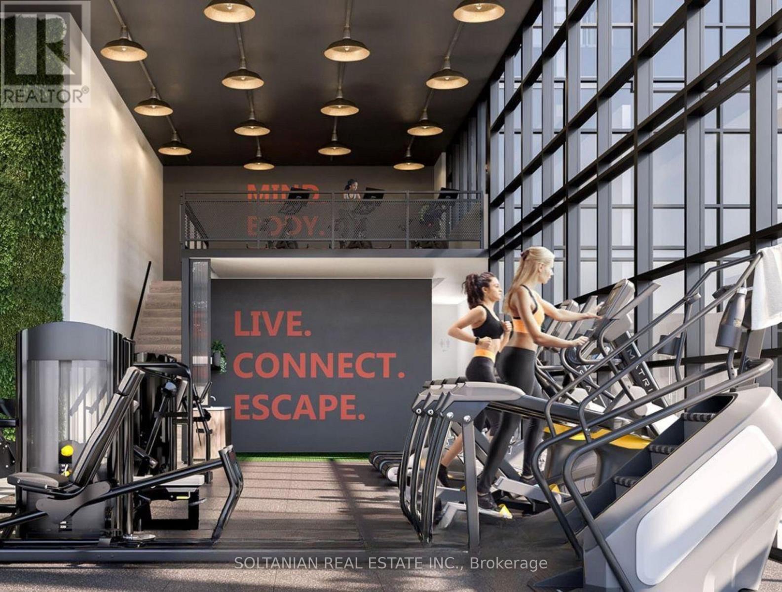 A gym with a green wall and a sign that says "Live. Connect. Escape."
