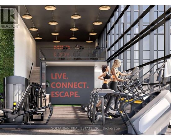 A gym with a green wall and a sign that says "Live. Connect. Escape."