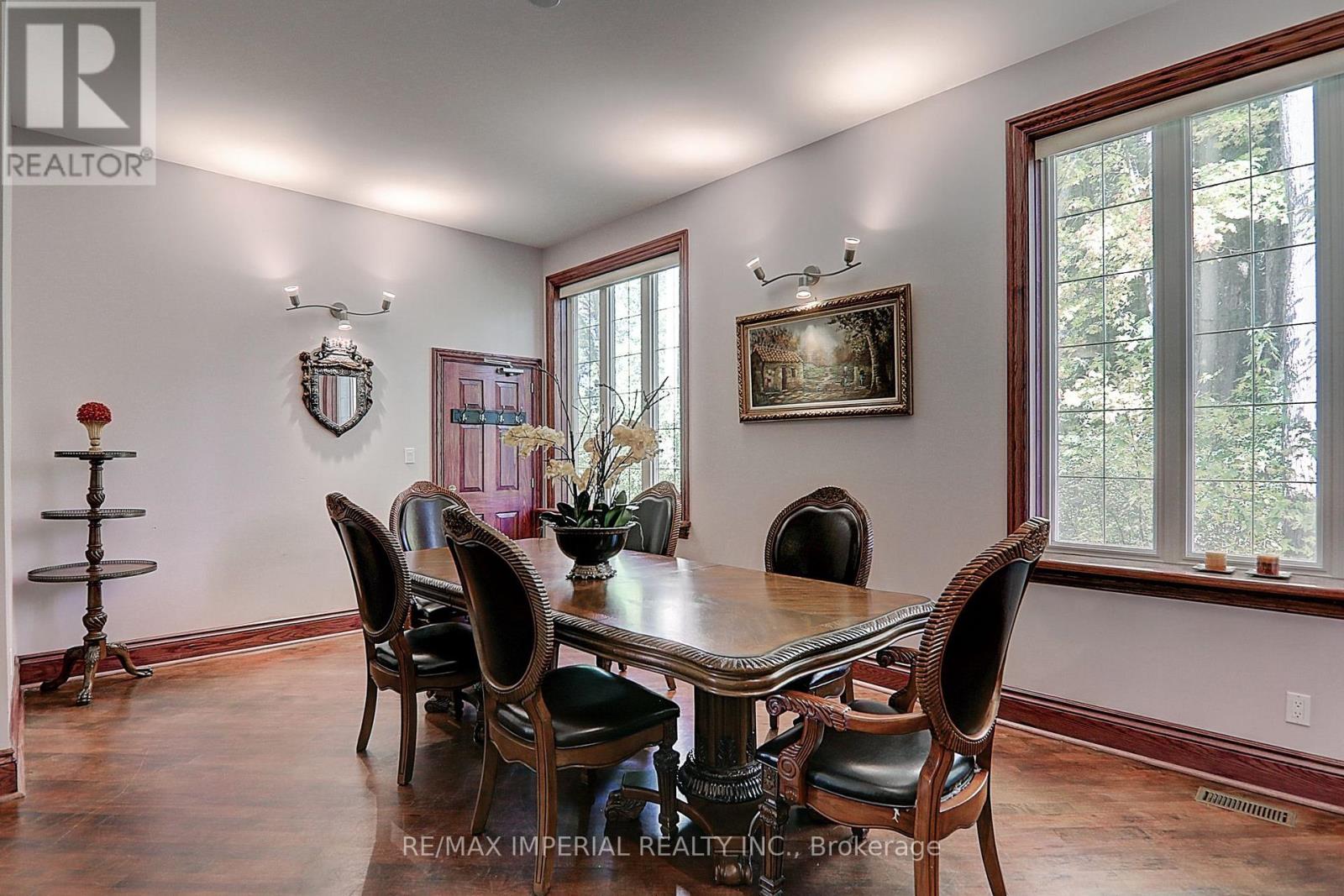 A dining room with a table set for six.