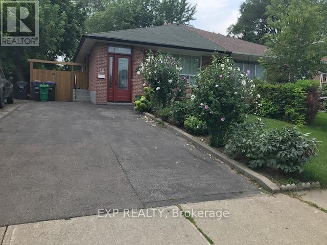 A house with a red door is for sale.