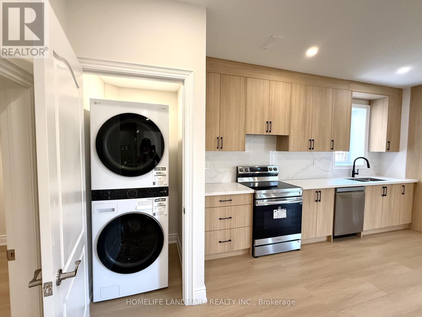 A modern kitchen with wooden cabinets and a stainless steel dishwasher and oven.