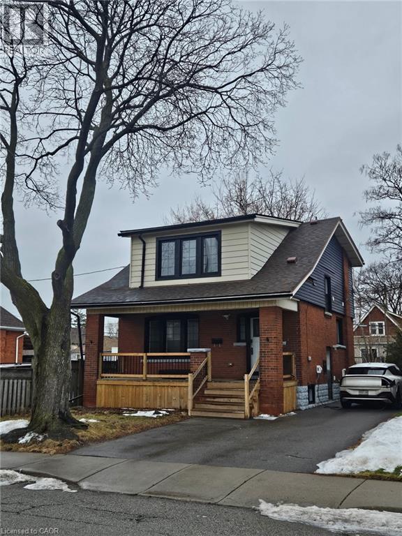 A house with a car parked in front.