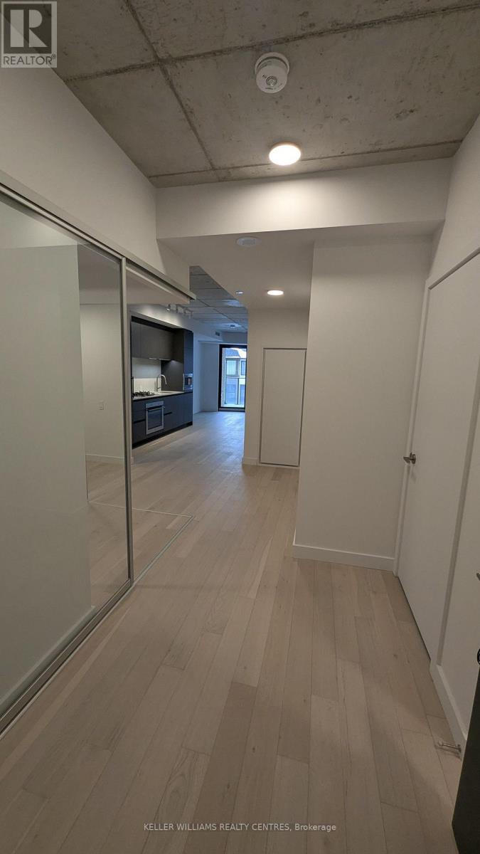 A long hallway with a door at the end.