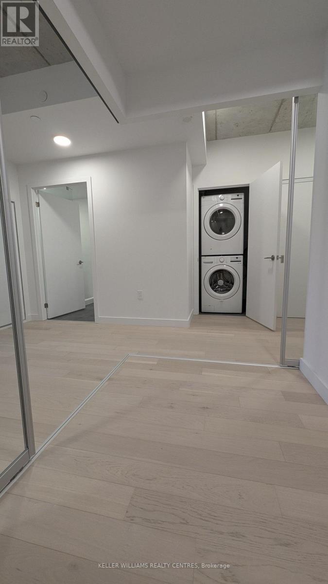 A laundry room with a washer and dryer in it.