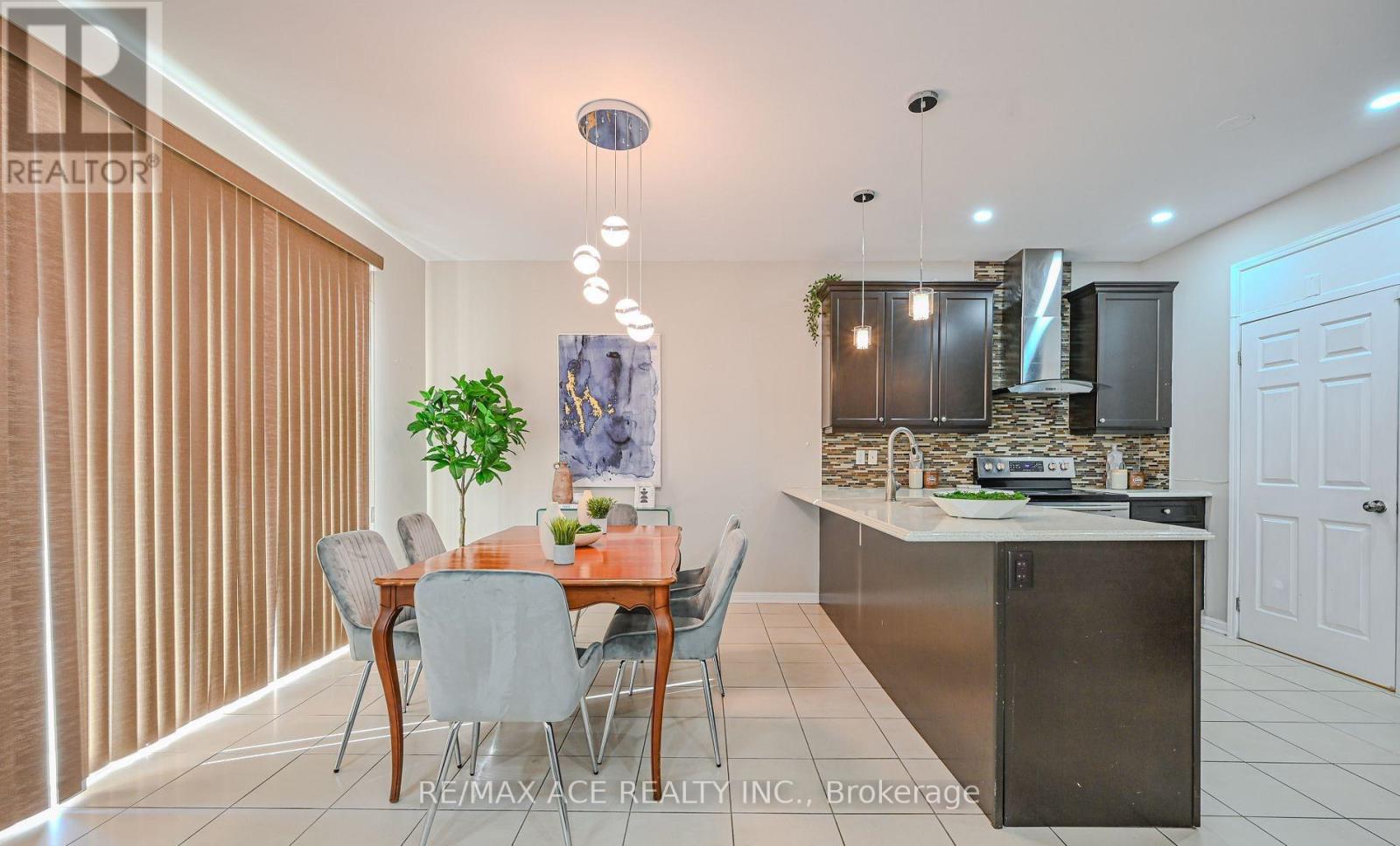 A dining room with a table set for four.