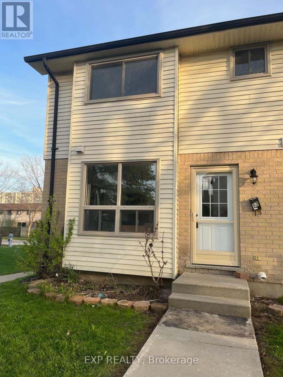 A house with a white door and windows is for sale.
