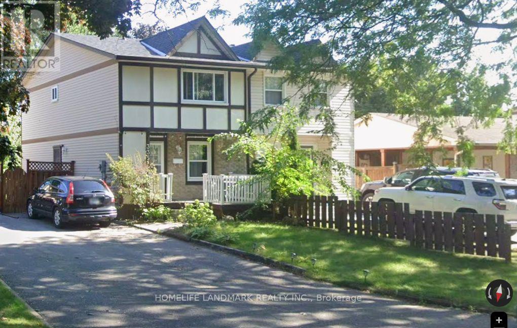 A house with a white picket fence in front of it.