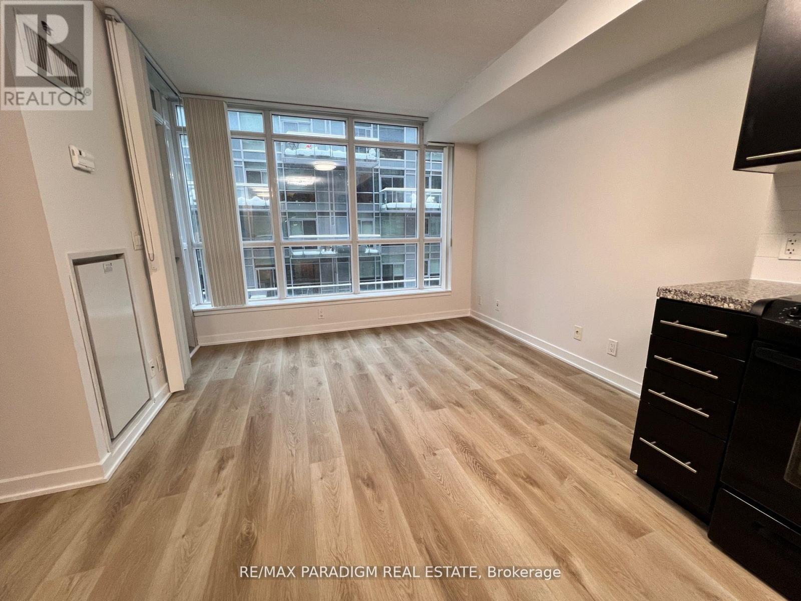 A room with REALTOR sign on the wall.