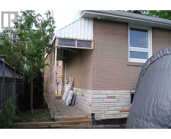 A house with a brick wall and a window.