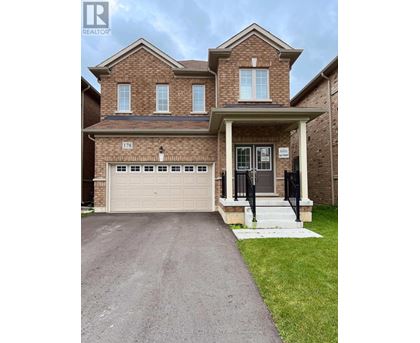 A brick house with the number 178 on the front.