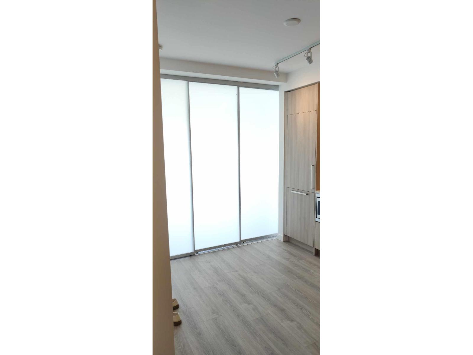 A room with a sliding door and a radiator.