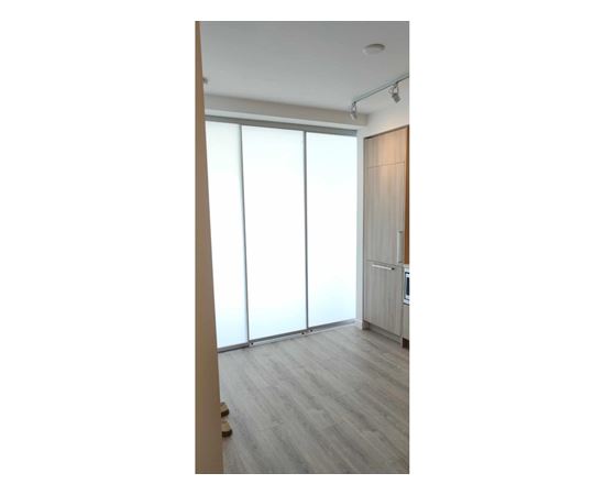 A room with a sliding door and a radiator.
