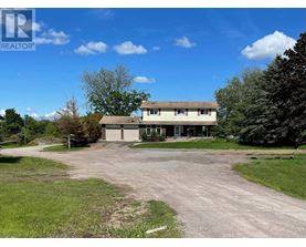 A large house with a driveway in front of it.