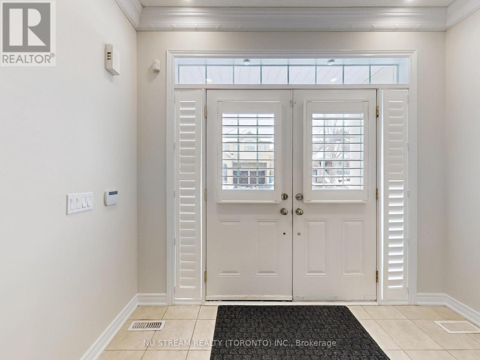 A white door with a glass window is closed.