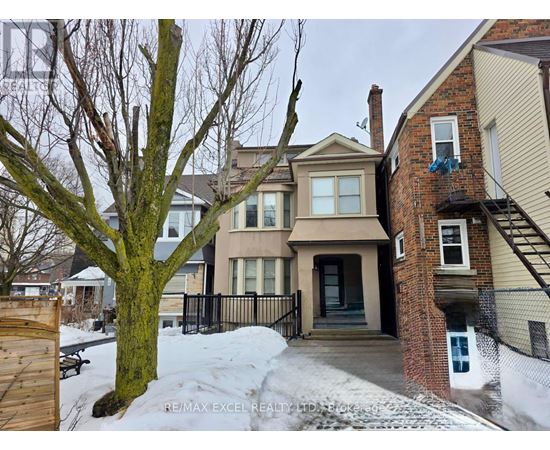 A house with a tree in front of it.