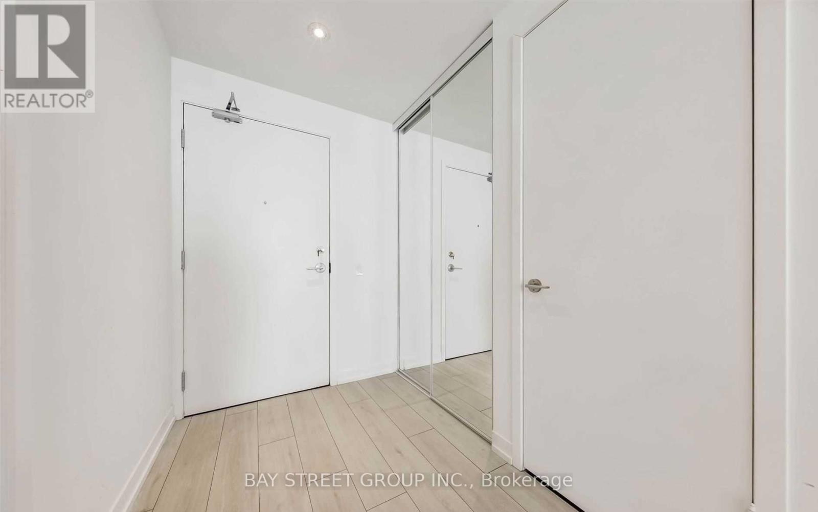 A white door is on the left and a white door is on the right.
