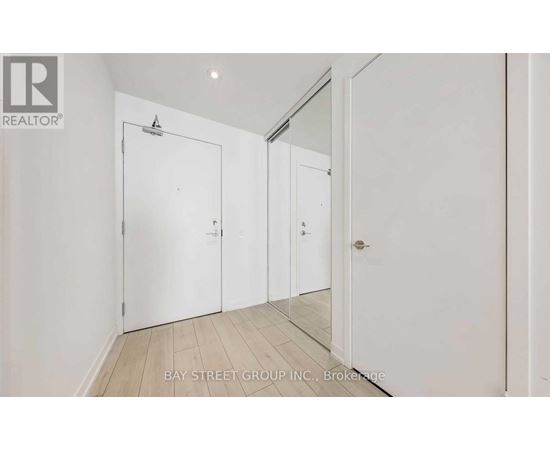 A white door is on the left and a white door is on the right.