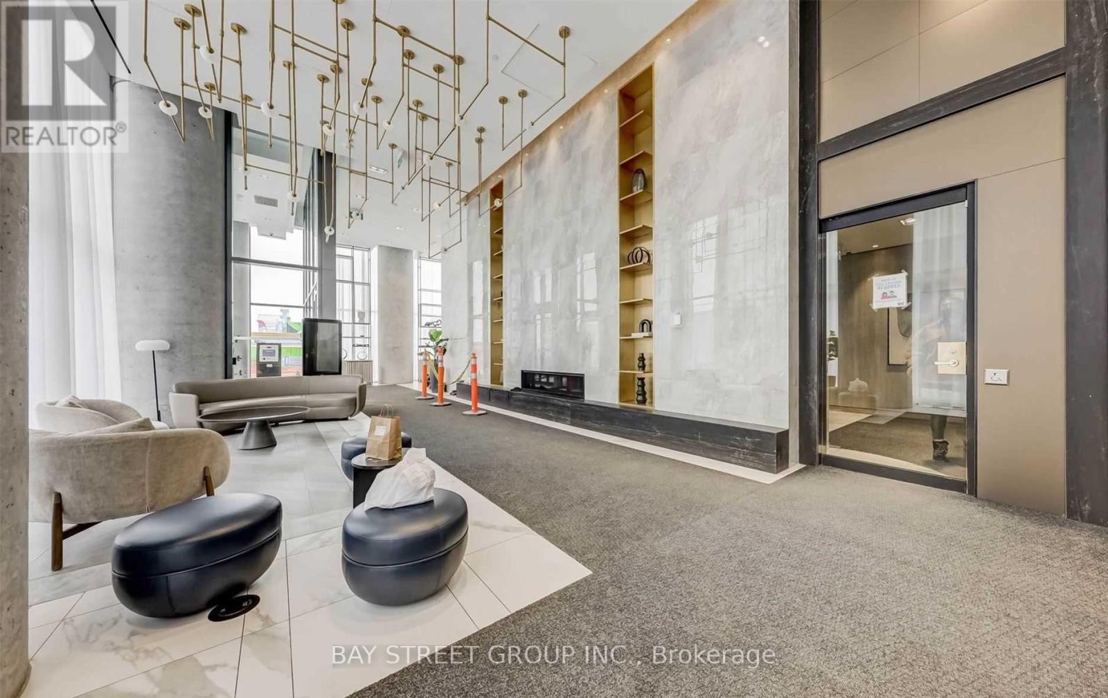 A modern office space with a reception area and a glass wall.