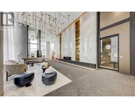 A modern office space with a reception area and a glass wall.