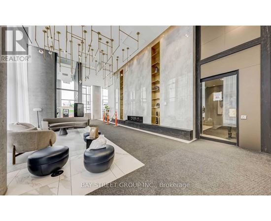A modern office space with a reception area and a glass wall.