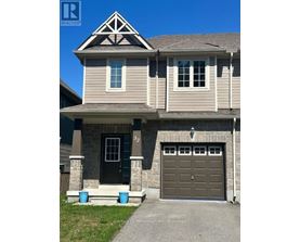 A house with a garage door and a window.