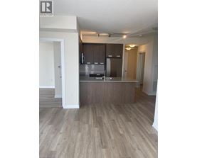 A kitchen with wooden cabinets and a countertop.