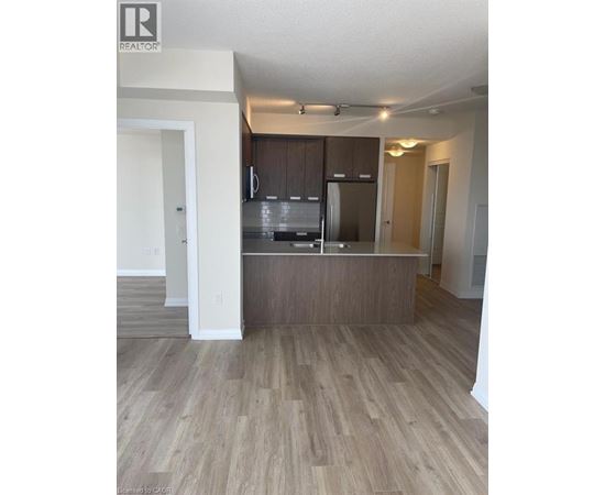 A kitchen with wooden cabinets and a countertop.