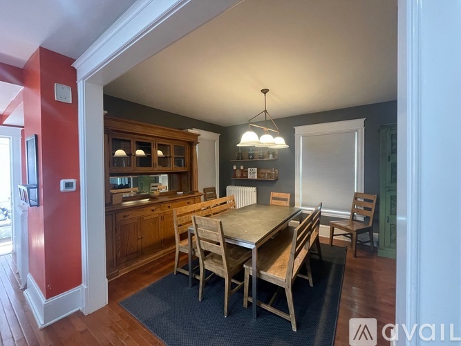 A kitchen with a table and chairs in the middle of the room.