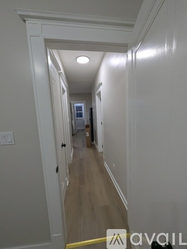 A hallway with a yellow line on the floor.