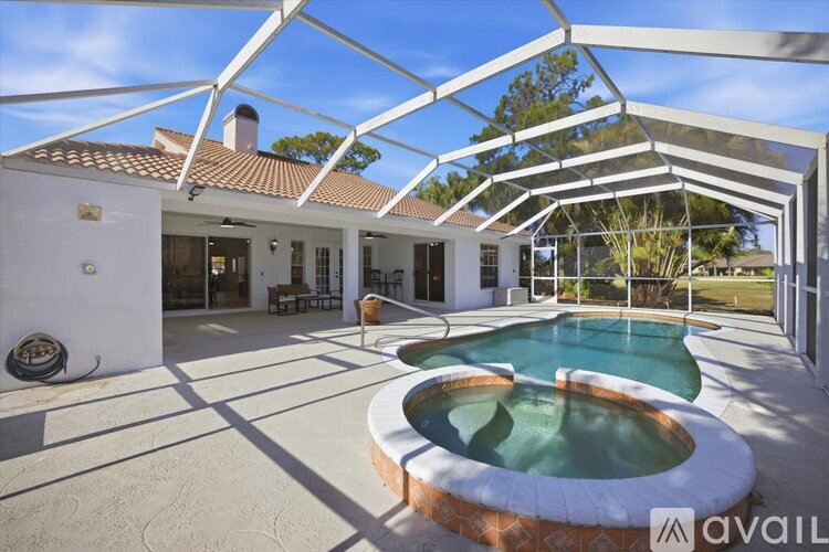 A house with a pool and a glass roof.