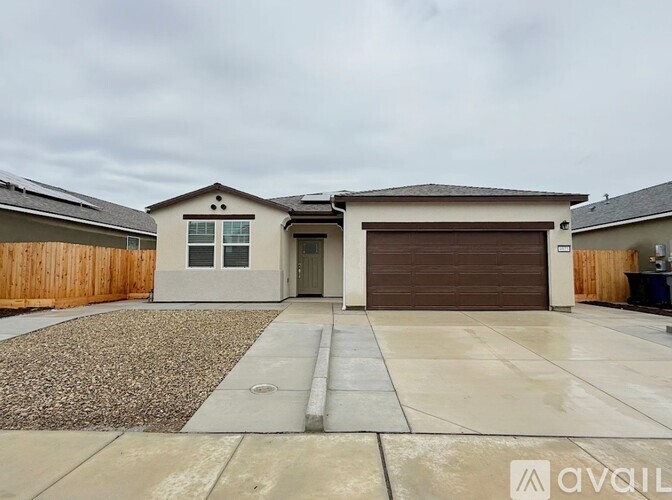 A house with a garage is for sale.
