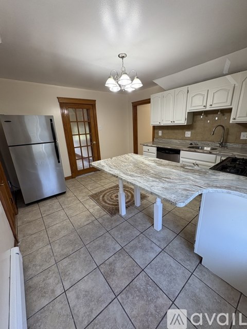 A kitchen with a stove top oven and a microwave.