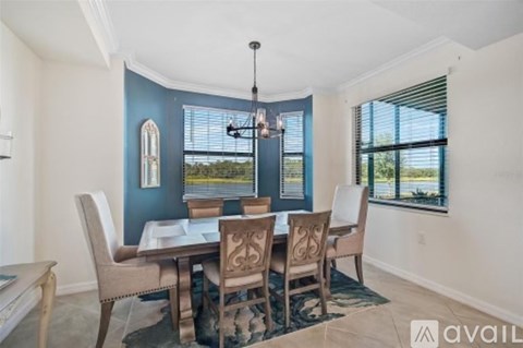 A dining room with a table set for four.