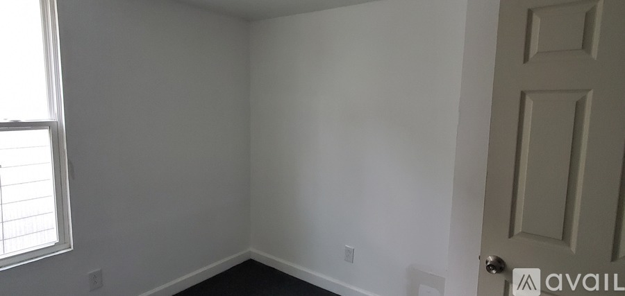 A room with a door and a window.