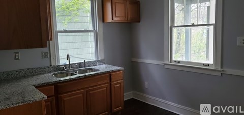 A kitchen with a sink and a window.