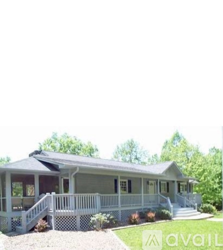A house with a porch and a covered entrance.