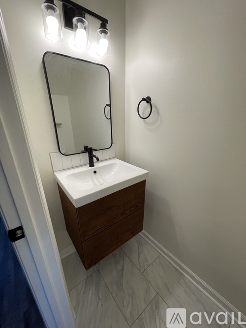 A bathroom sink with a mirror above it.