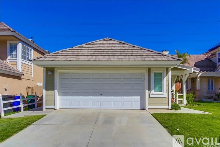 A house with a garage and a driveway is for sale.