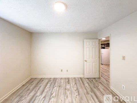 A white washing machine and dryer in a small laundry room.