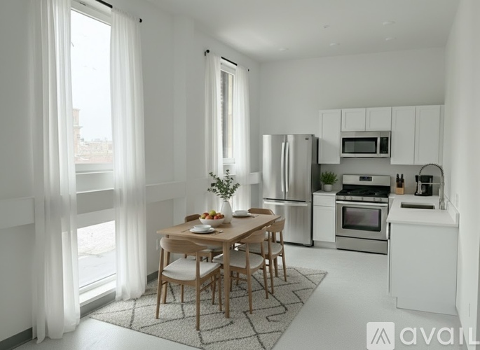 A modern kitchen with a dining table set for two.