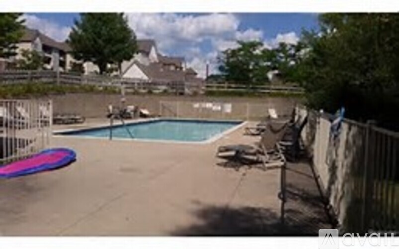 A pool with a pink and blue striped object in the middle.