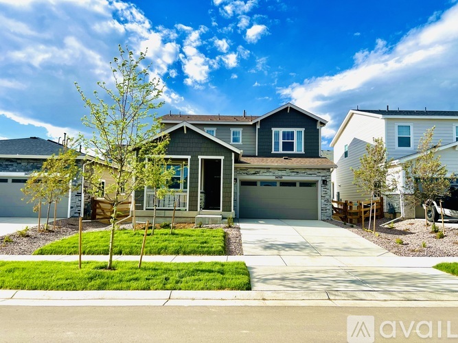 A house with a garage is available for sale.