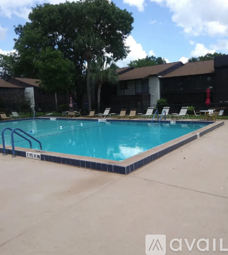A pool with chairs around it and a sign that says "EXIT".